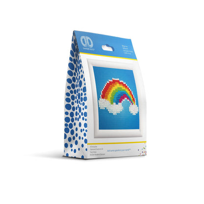 The Diamond Dotz Ever Living Rainbow - Framed kit by Diamond Dotz features a blue and white box with a framed diamond art rainbow and clouds design, displayed upright against a white background.