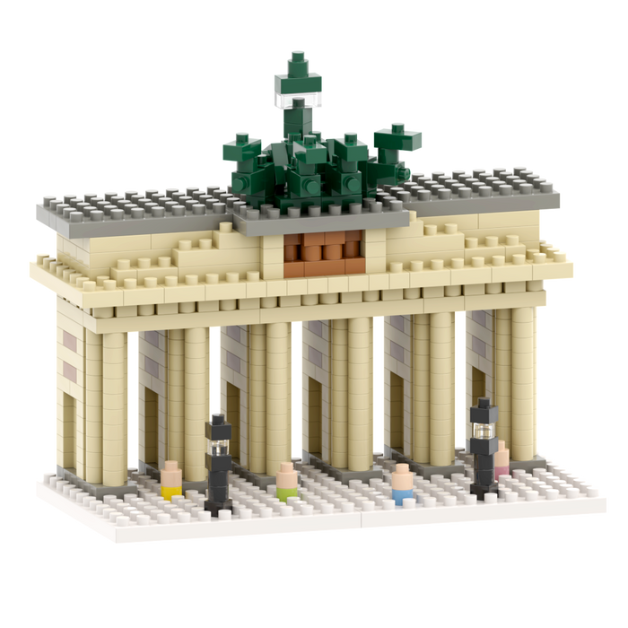 The Brixies Large Gift Box Brandenburg Gate is a micro-brick kit with six columns, a gray roof, green trees on top, and tiny block figures in front, all set on a white base.