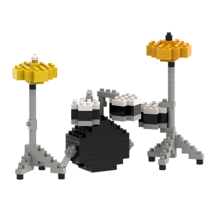 The Brixies Large Zip Bag Drum Kit is a micro-brick drum set with a black and white bass drum, two small toms, and two yellow cymbals on gray stands, all assembled from interlocking plastic bricks.