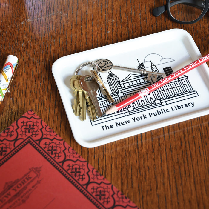 A white rectangular fiberglass tray with an illustration of The New York Public Library building and the New York City skyline in black.