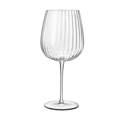 A clear, sophisticated Jenever Gin glass with vertical ridges, featuring a thin stem and flat foot on a white background