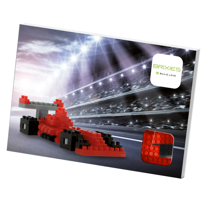 A Brixies Postcard Racing Car box showcases a red race car built from micro bricks on a racetrack with bright lights, and the Brixies logo appears in the top right corner.