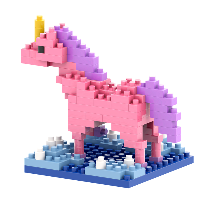 The Brixies Postcard Unicorn is a charming mini build kit featuring colorful micro bricks—mainly pink with a yellow horn, purple mane and tail—standing on a blue base with white and blue accents, perfect for unicorn lovers.