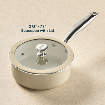 Beige saucepan with lid on a beige background