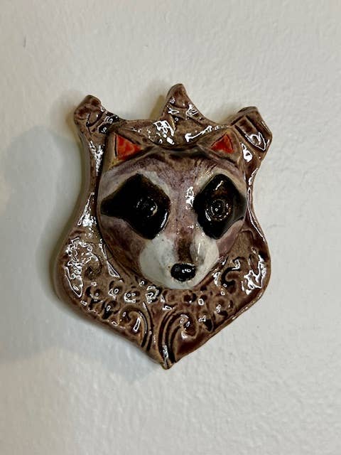 Raccoon on a Plaque