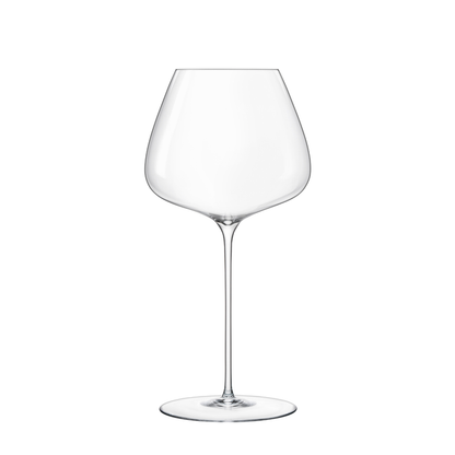 A clear Sapientia Burgundy glass by Luigi Bormioli on a white background
