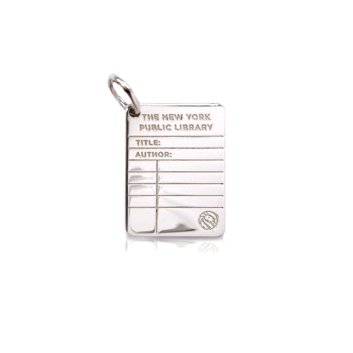 Silver library card charm. Top of charm is  imprinted 'The New York Public Library'.  On lines below are imprinted 'Title:' and 'Author:' and the bottom of the charm has NYPL's lion logo.