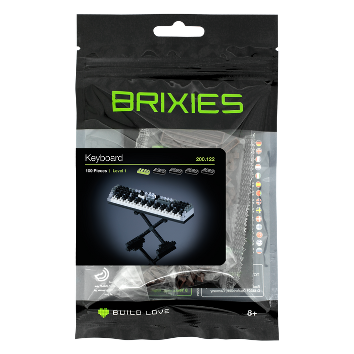 The Brixies Small Zip Bag Keyboard is a micro-brick kit with 100 pieces for ages 8+, featuring a 3D piano keyboard model in sleek black packaging and includes a reusable zip storage bag for easy organization.