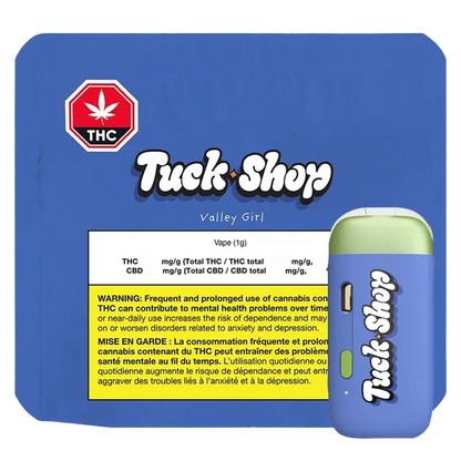 Angled view of a blue and green Valley Girl Pure Cured Resin Disposable Vape beside its blue Tuck Shop branded box showing a yellow THC warning label.