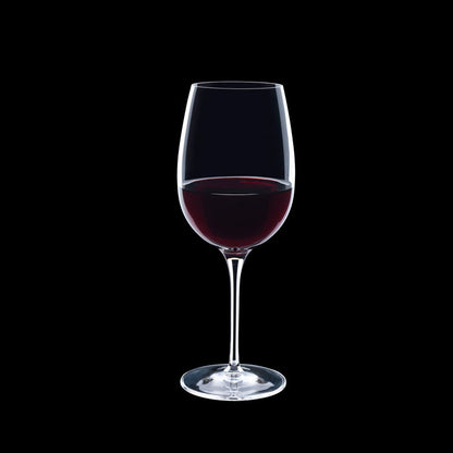 Vinoteque Ricco Red Wine Glass filled with red wine on a black background