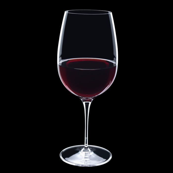 Vinoteque Riserva Red Wine Glass filled with red wine on a black background